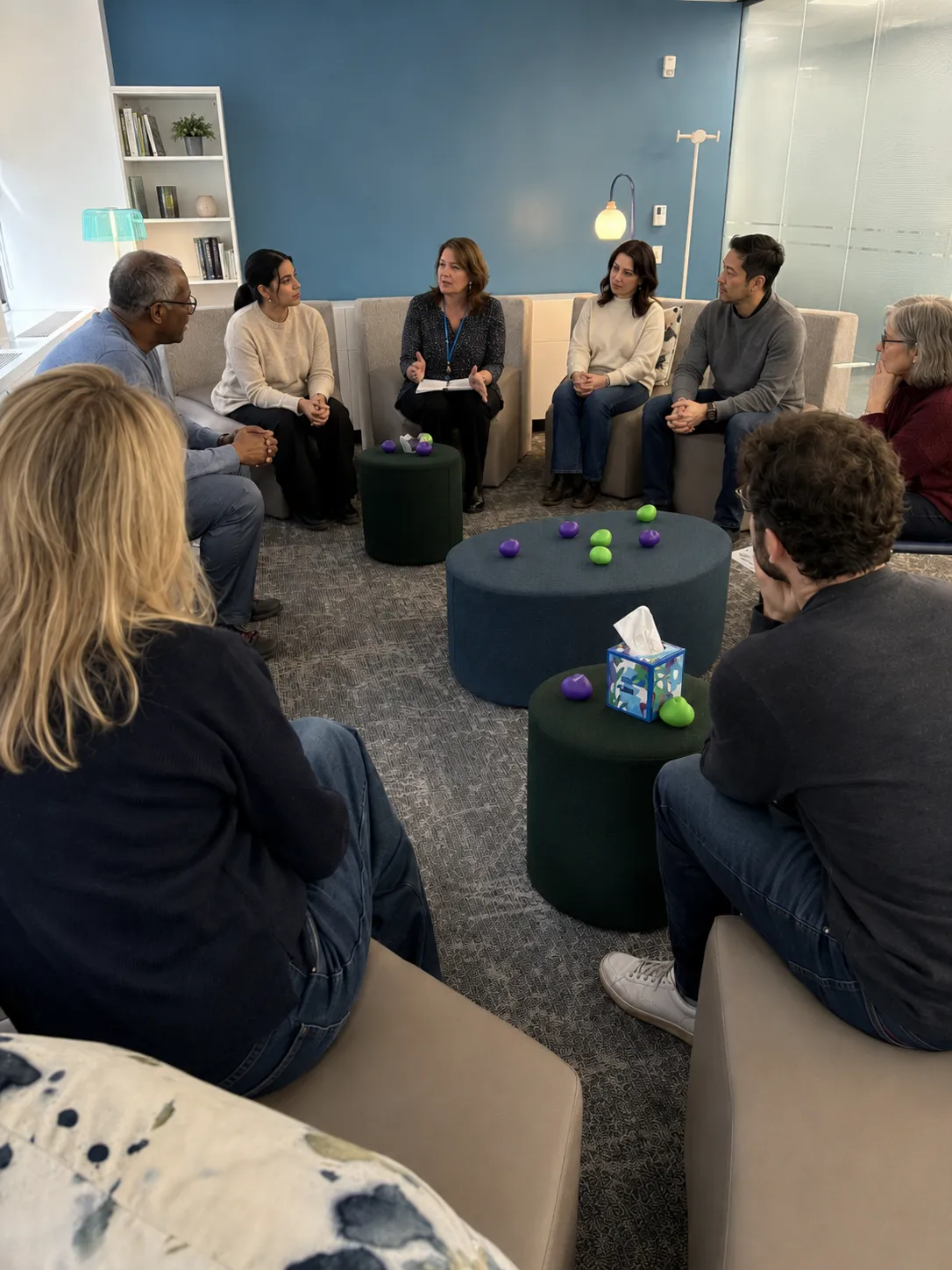 An adult grief support group meeting in a circle at Our House NYC