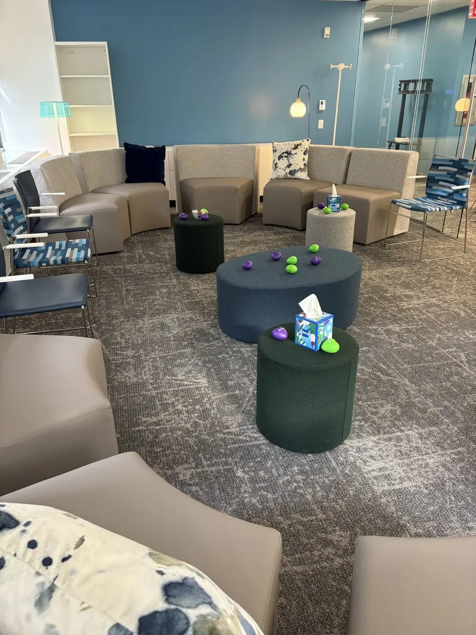 The Our House NYC group room — soft seating arranged in a circle